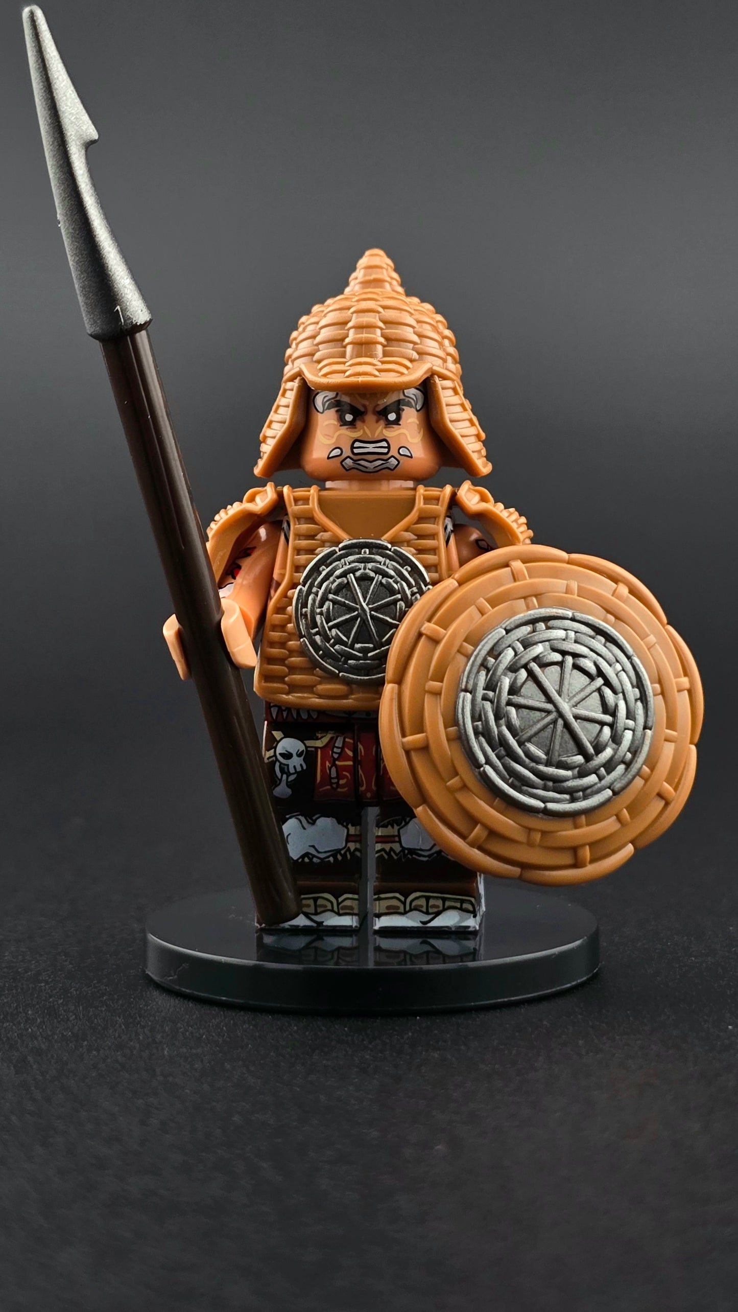 Custom fantasy inspired Wicker Guardian minifigure with brown wicker armor, silver accents, spear, and wicker shield. Detailed tribal soldier design compatible with leading brick style building sets.