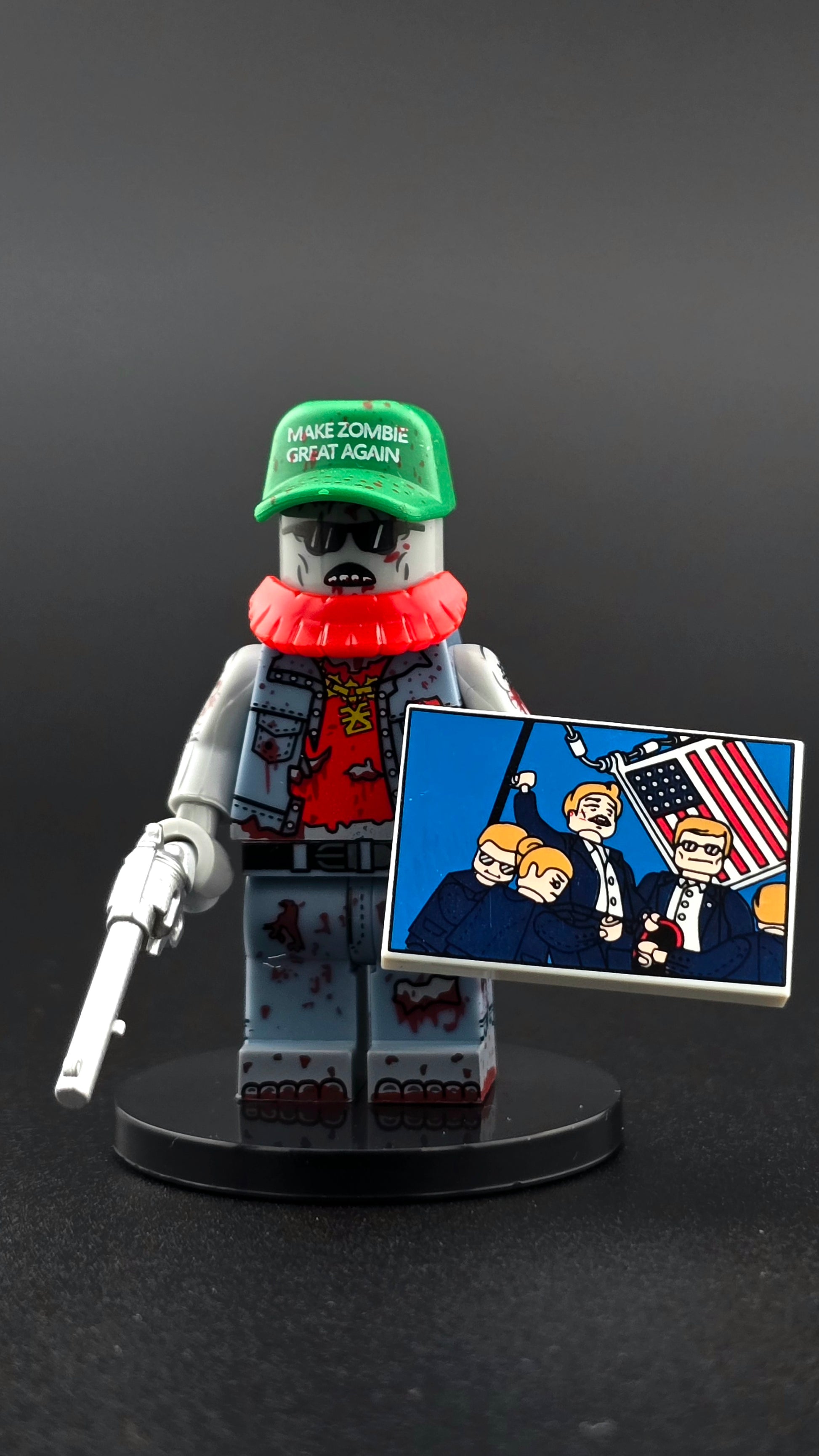 Custom MZGA Zombie minifigure with green Make Zombie Great Again hat, red beard, and bold fantasy styling, shown with revolver and presidential picture accessories and compatible with leading brick-style systems.