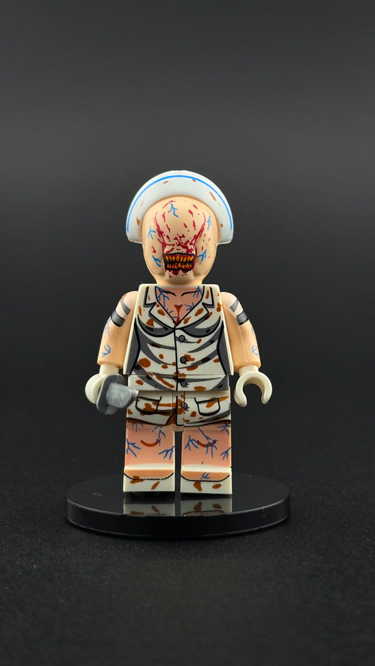 Custom gaming inspired Silent Hill nurse minifigure in white with vein details, eerie expression, and knife accessory. Designed with unsettling horror styling compatible with leading brick style building sets.