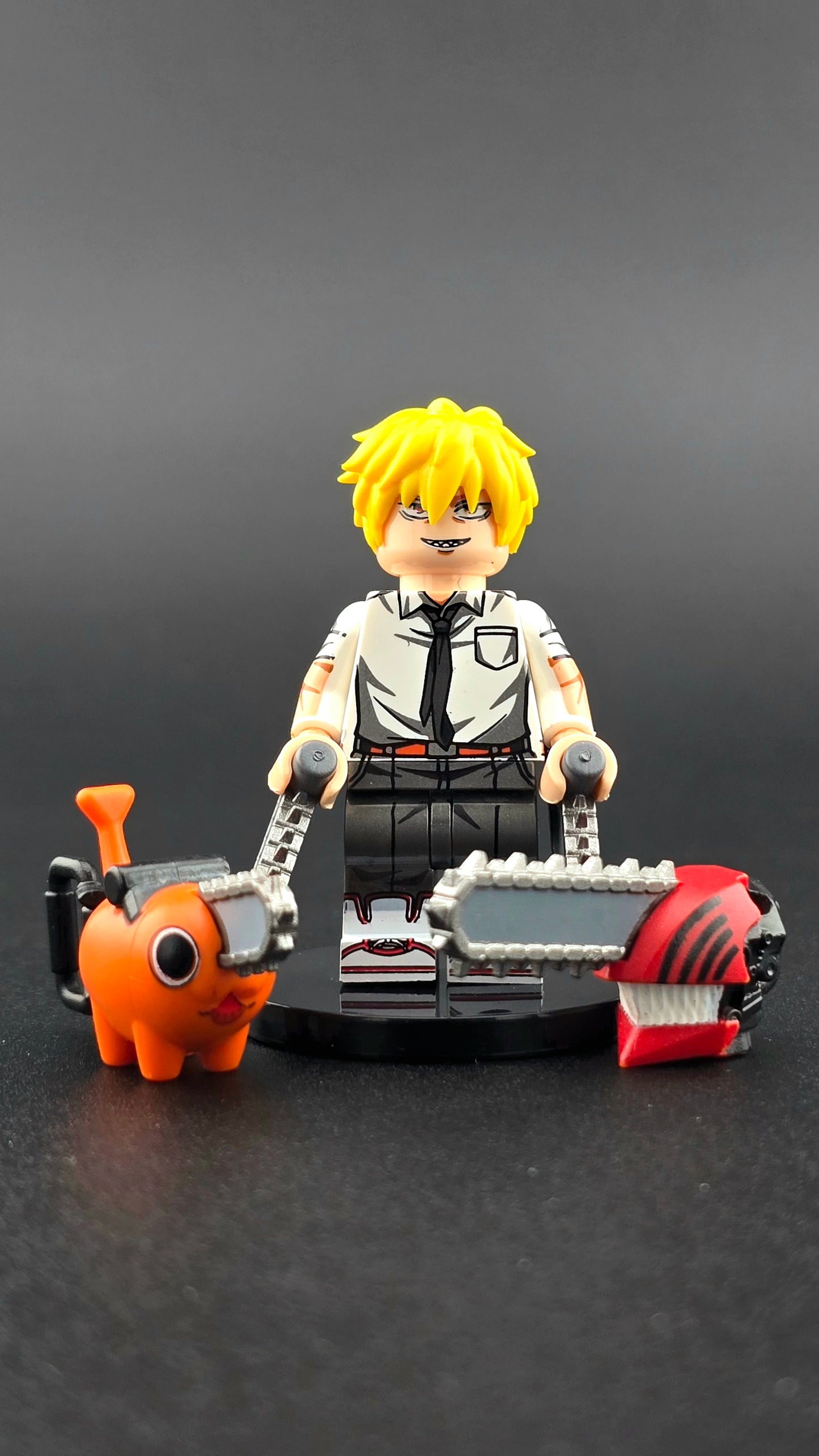 Custom anime-inspired Denji minifigure from Chainsaw Man with chainsaw head, chainsaw arms, and Pochita companion, compatible with leading brick-style building systems.